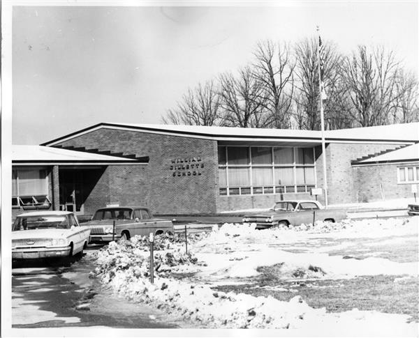 The front entrance of the Gillette school in winter.